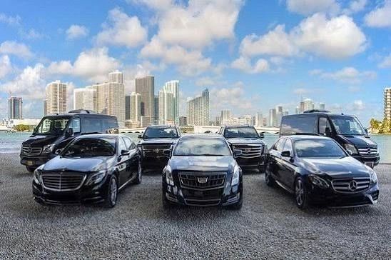 Luxury vehicles lineup urban skyline